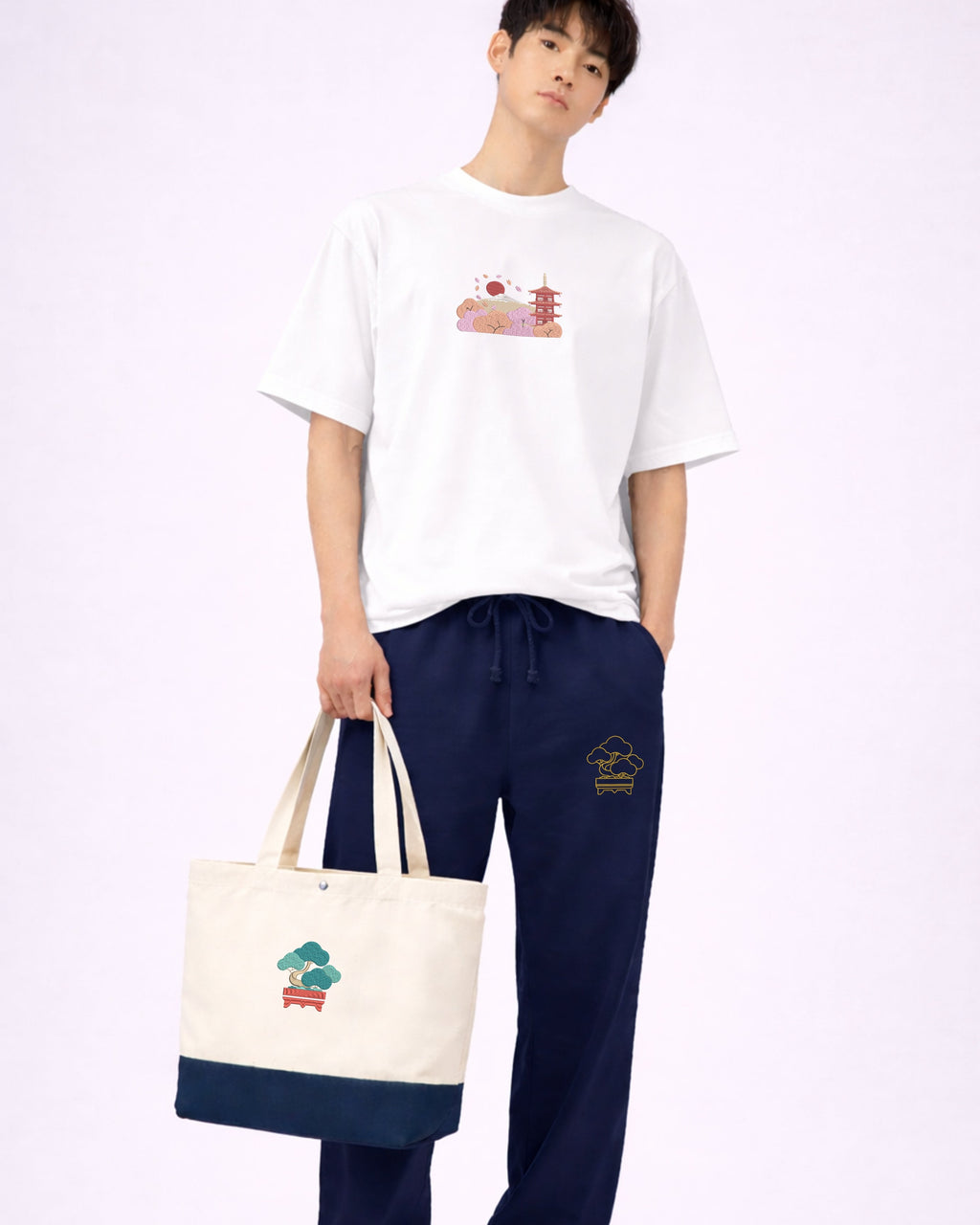 Andrew Joyce embroidered 17L eco-sustainable two-tone tote bag in beige and navy with intricate japanese bonsai embroidered art.