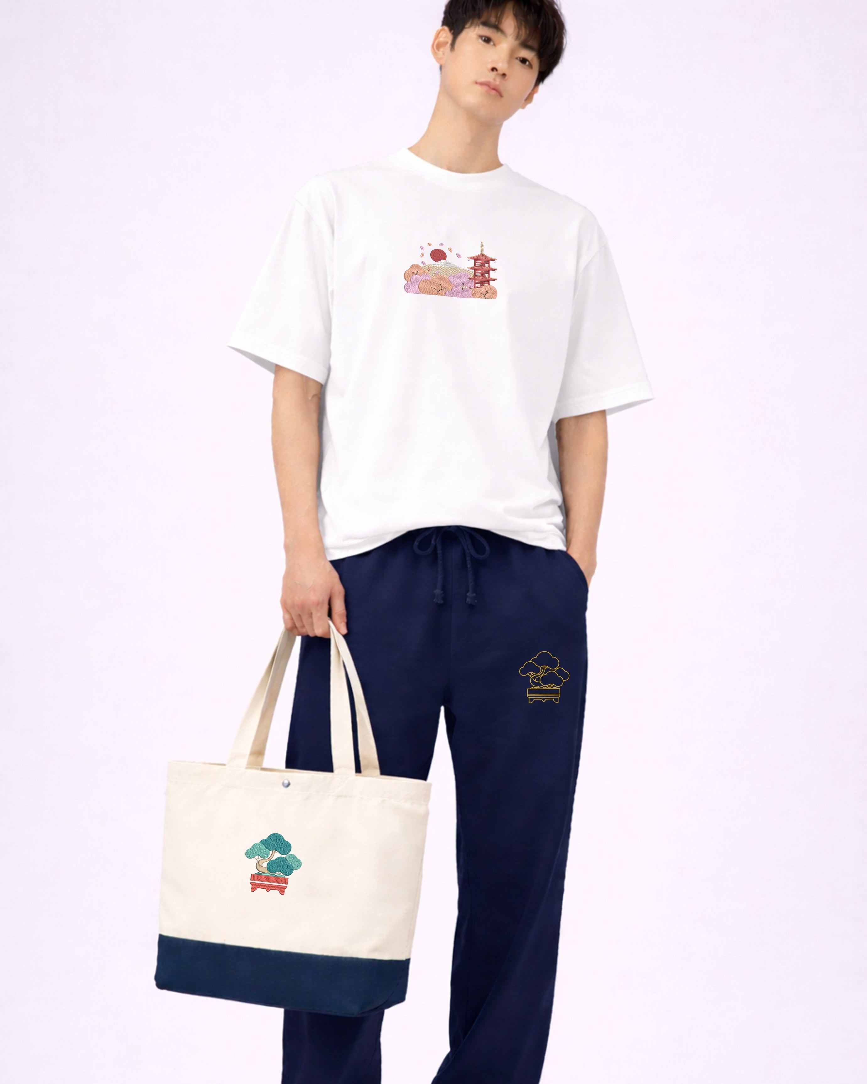 Andrew Joyce embroidered 17L eco-sustainable two-tone tote bag in beige and navy with intricate japanese bonsai embroidered art.