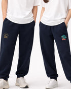 Detail shot of Andrew Joyce bespoke embroidery on 300gsm navy cotton sweatpants with Bonsai textured stitch finish.
