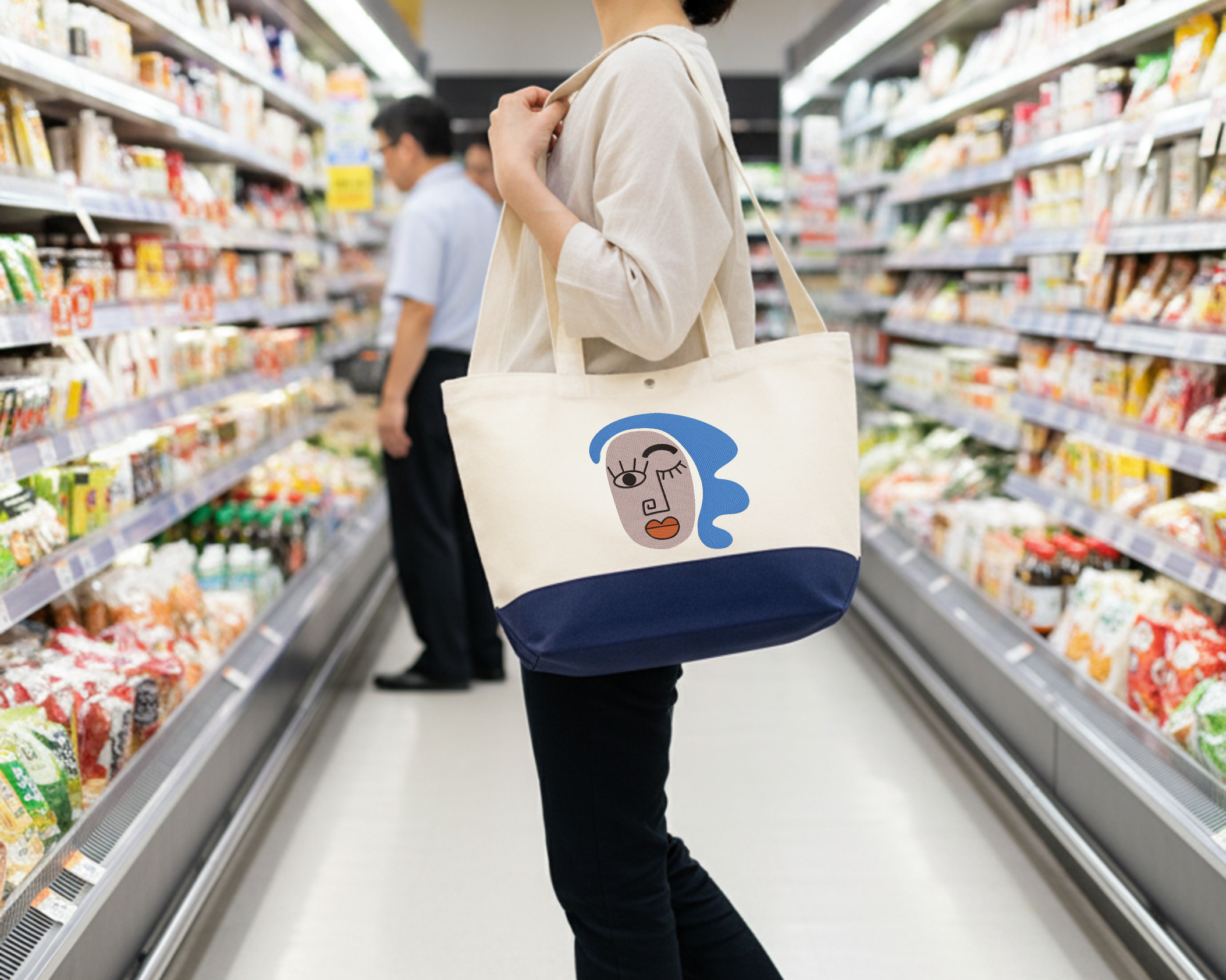 芸術的なインドの抽象的な顔のイラストが刺繍されたトートバッグ