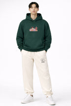 Andrew Joyce forest green 450gsm heavyweight pullover hoodie featuring multi-tone textured embroidery and double-stitched hood.Golden bonsai front, Chureito Pagoda with Mount Fuji back embroideries